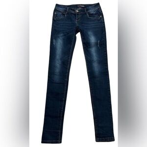 Women’s distressed skinny jeans. Size small (4) with 32” inseam. 7.5” rise